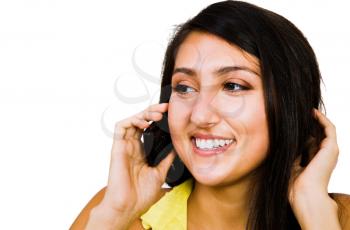 Confident woman talking on a mobile phone isolated over white