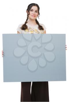 Woman holding a placard and smiling isolated over white