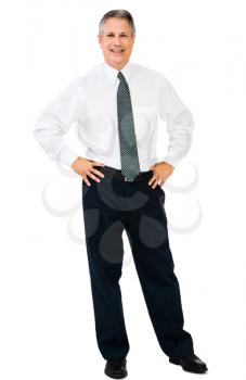 Businessman standing with his arms akimbo isolated over white