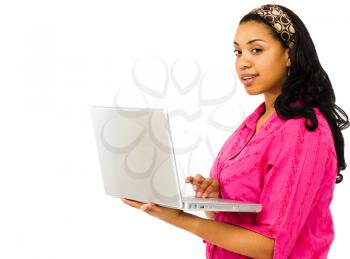 Portrait of a young woman using a laptop isolated over white