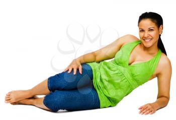 Happy young woman reclining and smiling isolated over white