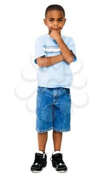 Boy thinking with his hand on his chin isolated over white