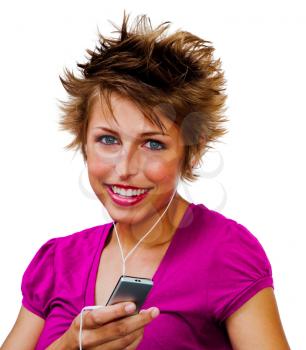 Young woman listening to music on a MP3 player isolated over white