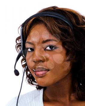 Close-up of a businesswoman wearing headset isolated over white