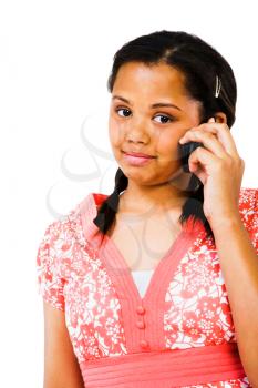 Portrait of a teenage girl talking on a mobile isolated over white