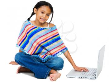Smiling girl working on a laptop isolated over white