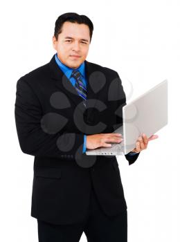 Portrait of a businessman working on a laptop isolated over white