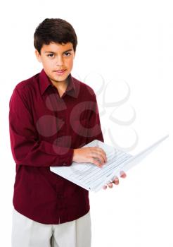 Child using a laptop isolated over white