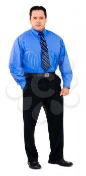 Businessman standing with his hands in his pockets isolated over white