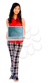 Woman showing a laptop and smiling isolated over white