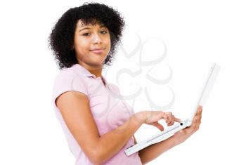 Close-up of teenage girl using a laptop and smiling isolated over white