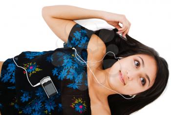 Happy woman listening to music on MP3 player isolated over white