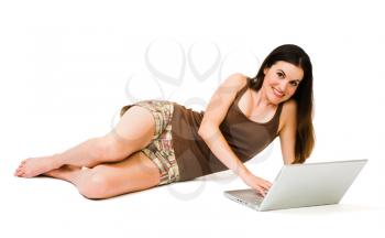 Close-up of a young woman using a laptop isolated over white