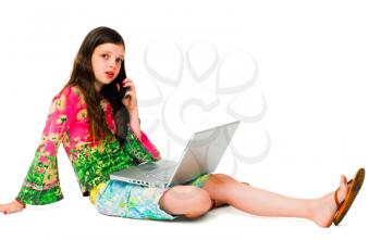 Caucasian girl using a laptop and a mobile isolated over white