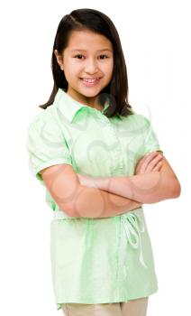 Asian girl standing with her arms crossed isolated over white