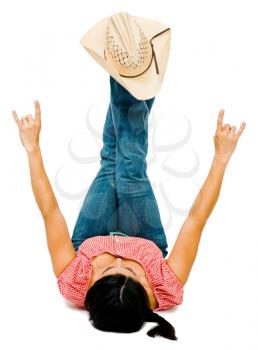 Excited woman playing with a hat and posing isolated over white