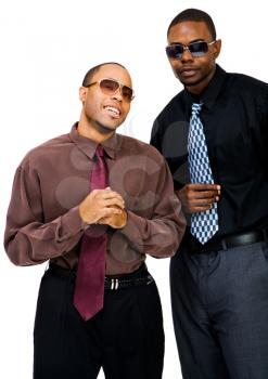 Young businessmen posing and smiling together isolated over white