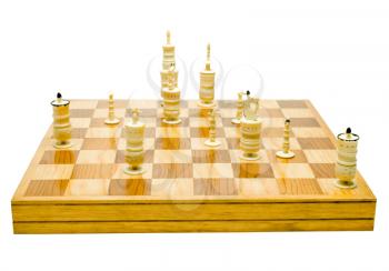 Chesspieces on a chessboard isolated over white