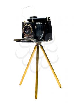 Old camera on a tripod isolated over white