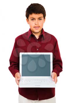 Portrait of a boy showing a laptop isolated over white