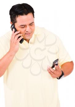 Latin American man using a phone isolated over white