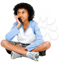 Boy talking on the phone isolated over white