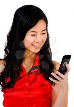 Close-up of a woman text messaging on a mobile phone isolated over white