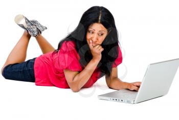 Confused mid adult woman using a laptop isolated over white