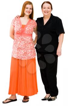 Daughter and mother smiling together isolated over white