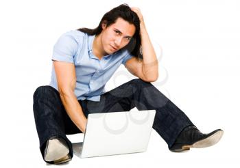 Close-up of a young man using a laptop isolated over white