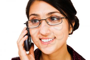 Young woman talking on a mobile phone isolated over white