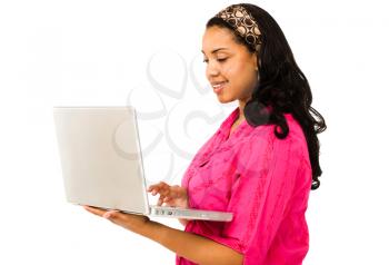 Close-up of a young woman using a laptop isolated over white