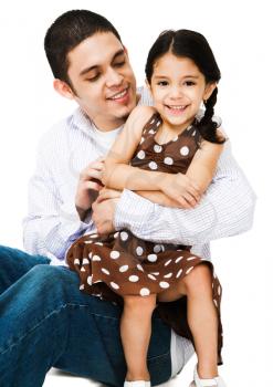 Smiling man hugging a girl isolated over white