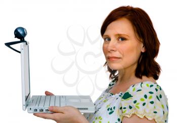 Close-up of a woman using a laptop and posing isolated over white