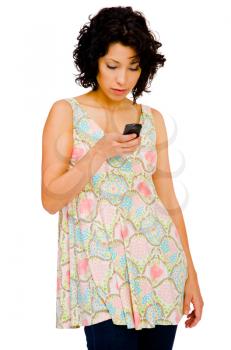 Fashion model text messaging on a mobile phone isolated over white
