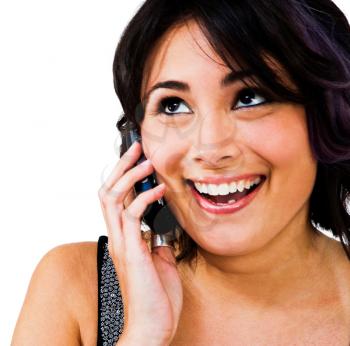 Smiling woman talking on a mobile phone isolated over white