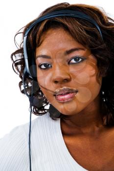 Young businesswoman wearing headset isolated over white
