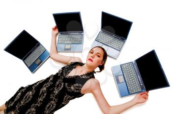 Woman lying near laptops and posing isolated over white