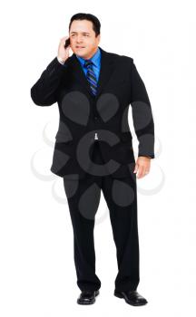Businessman talking on a mobile phone isolated over white