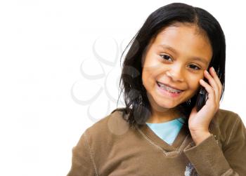 Latin American and Hispanic girl talking on a mobile phone isolated over white