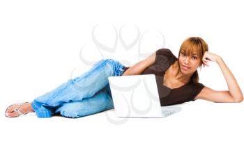 Mixed race young woman using a laptop isolated over white