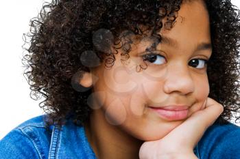 African-American girl smirking with hand on chin isolated over white