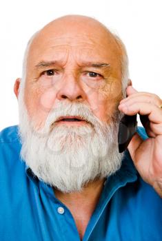 Caucasian man talking on a mobile phone isolated over white