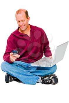 Man using a mobile phone and a laptop isolated over white