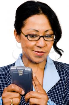 Happy businesswoman text messaging on a mobile phone isolated over white