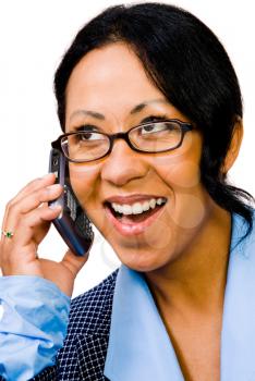 Close-up of a businesswoman talking on a mobile phone isolated over white