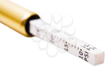 Close-up of a tire pressure gauge isolated over white
