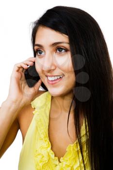 Fashion model talking on a mobile phone isolated over white
