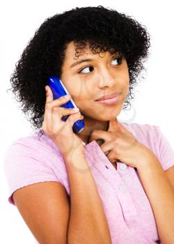 Close-up of a teenage girl talking on a mobile phone isolated over white