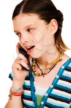 Happy girl talking on a mobile phone isolated over white